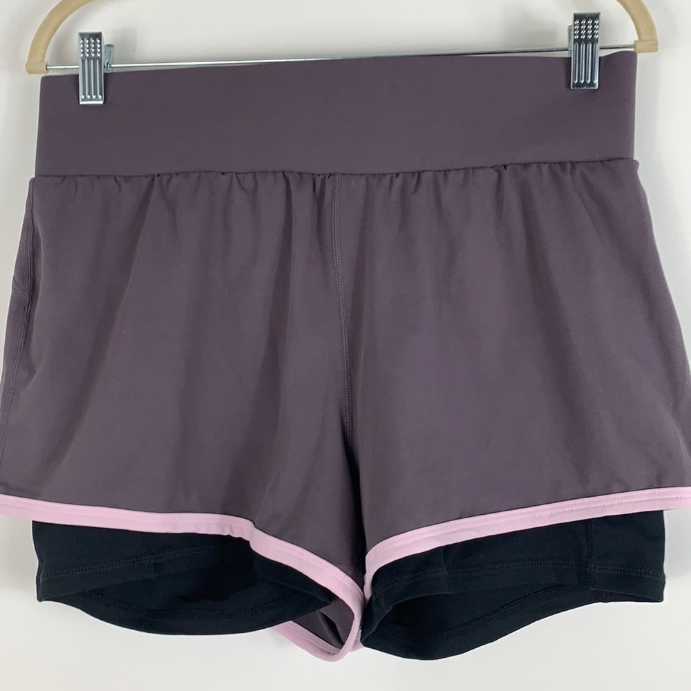 Fabletics plum athletic shorts with pink trim Lg